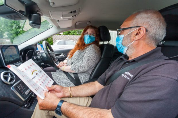 Why We Are Consulting On Making It A Requirement For Driving instructor and his pupil taking a driving lesson